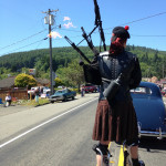 The only thing cooler than a bagpipe player on stilts is a bagpipe player WITH FIRE. :D This was taken as Dara and I and others with the Clallam Bay Comicon were following Fire Piper Niall Townley during the Clallam Bay Fun Days Parade!